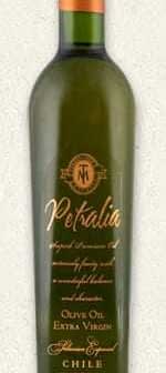 Green glass bottle of Petralia extra virgin olive oil with a gold label and cork top. - Olive Oil Times