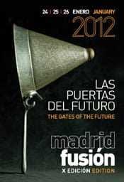 Poster for Madrid Fusion 2012 featuring a bell and event details in Spanish and English. - Olive Oil Times
