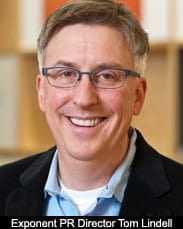 Portrait of Tom Lindell, the PR Director at Exponent, smiling and wearing glasses. - Olive Oil Times