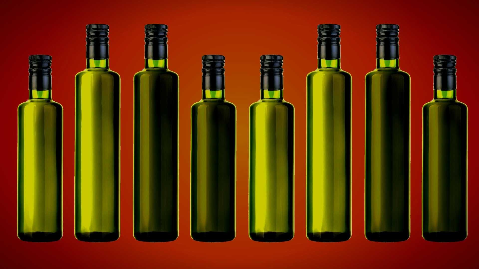 Eight green glass bottles with black caps arranged in a row against a gradient background. - Olive Oil Times