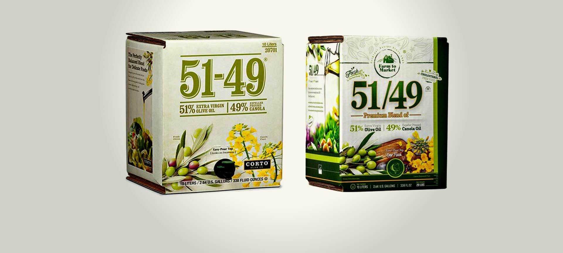 Deux boîtes d'huile d'olive extra vierge 51-49 avec des designs et un étiquetage distincts. - Olive Oil Times