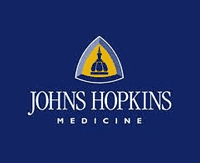 Logo of Johns Hopkins Medicine featuring a blue background with a yellow emblem and text. - Olive Oil Times