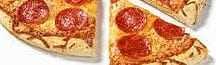 A pepperoni pizza with several slices removed, showing cheese and toppings. - Olive Oil Times