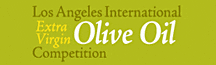 Logo for the Los Angeles International Extra Virgin Olive Oil Competition featuring text on a green background. - Olive Oil Times