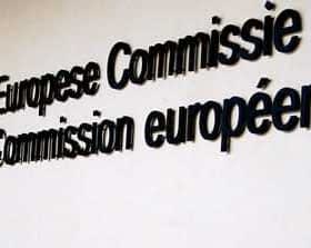 Sign displaying the names 'European Commission' and 'Commission européenne' with the EU flag. - Olive Oil Times