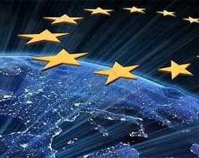 Representación gráfica de las estrellas de la Unión Europea sobre una vista de la Tierra por la noche. - Olive Oil Times