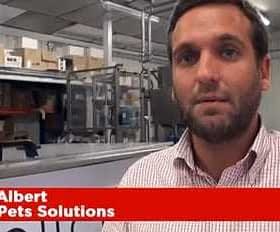 Paco Albert speaking in front of a production area at Pet Solutions. - Olive Oil Times