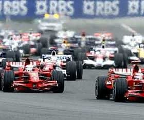 Several Formula 1 race cars competing on a track during a race event. - Olive Oil Times