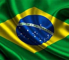 The flag of Brazil featuring green and yellow colors with a blue globe and white stars. - Olive Oil Times