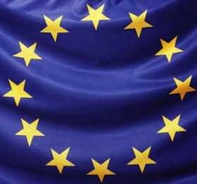 Flag of the European Union featuring a blue background with a circle of twelve yellow stars. - Olive Oil Times