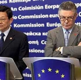 Two men standing at podiums during a press conference at the European Commission. - Olive Oil Times