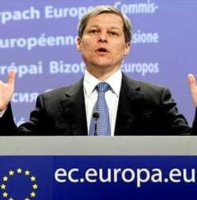 A man gesturing while speaking at a podium featuring the European Union logo. - Olive Oil Times