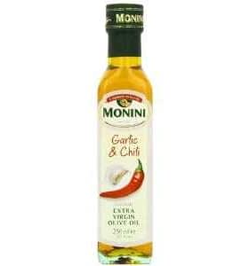 Bottle of Monini Garlic and Chili Extra Virgin Olive Oil with a red chili pepper design. - Olive Oil Times