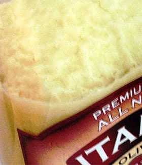 Container of olive oil showing a creamy, thick texture at the top. - Olive Oil Times