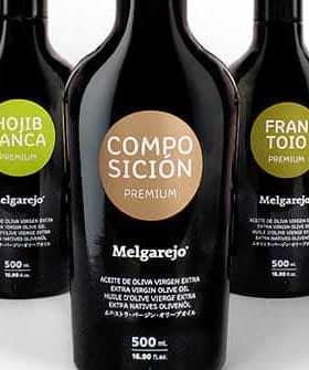 Five bottles of Melgarejo premium olive oil with different labels and designs. - Olive Oil Times