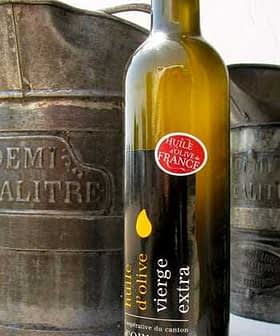 Bottle of extra virgin olive oil labeled 'huile d'olive vierge extra' from Ollioules, France. - Olive Oil Times