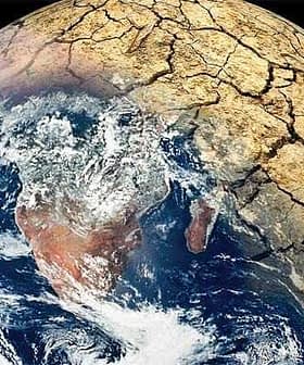 Image of Earth showing cracked land surface and visible water bodies from space. - Olive Oil Times