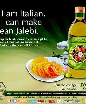 Advertisement for Leonardo Pomace Olive Oil featuring a bottle and jalebi dessert. - Olive Oil Times