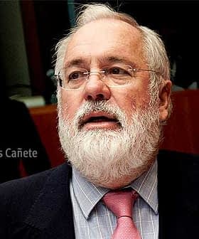 Close-up portrait of Miguel Arias Cañete with a beard and wearing a suit and tie. - Olive Oil Times