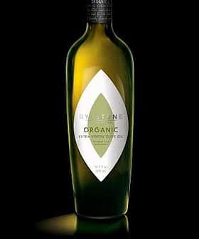 Green glass bottle of Rylstone organic extra virgin olive oil with a distinctive label design. - Olive Oil Times