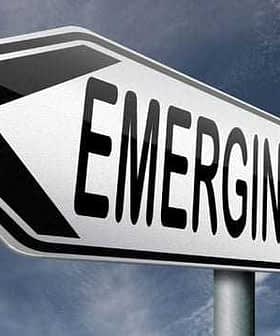 Directional sign indicating 'Emerging Market' with an arrow pointing left. - Olive Oil Times