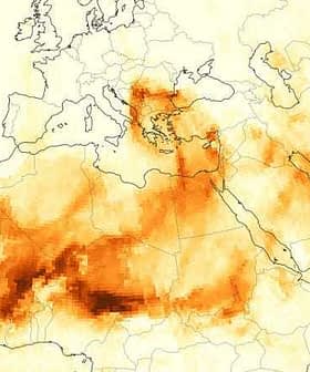 Map showing the distribution of red dust across Europe and North Africa with varying shades of orange. - Olive Oil Times
