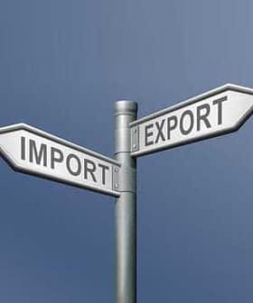 Directional signpost indicating 'Import' and 'Export' with arrows pointing in opposite directions. - Olive Oil Times