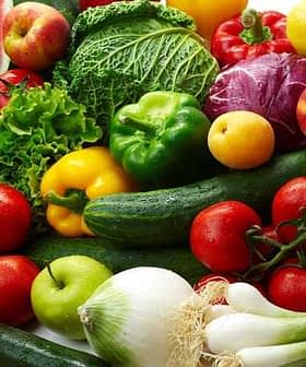 A variety of fresh vegetables and fruits including peppers, tomatoes, cucumbers, and leafy greens. - Olive Oil Times