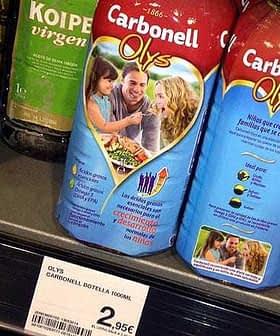 Carbonell Olys olive oil bottle displayed on a store shelf with price tag. - Olive Oil Times