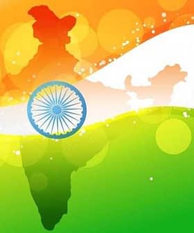 Graphic representation of the map of India in national flag colors with the Ashoka Chakra in the center. - Olive Oil Times