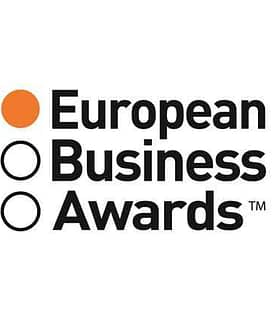 Logo of the European Business Awards featuring text and colored circles. - Olive Oil Times