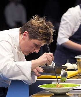 Chef focused on plating a dish during a cooking demonstration on stage. - Olive Oil Times
