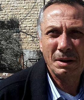 Middle-aged man with short hair, wearing a jacket and looking directly at the camera. - Olive Oil Times