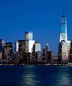 Night view of New York City skyline featuring One World Trade Center and surrounding buildings. - Olive Oil Times