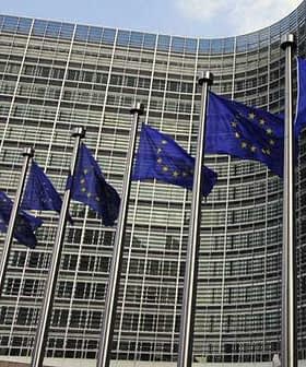 European Union flags displayed in front of the European Commission building in Brussels. - Olive Oil Times