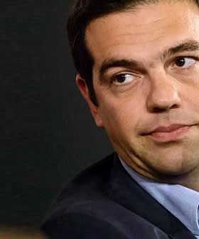 Close-up portrait of a man with dark hair wearing a suit and looking to the side. - Olive Oil Times