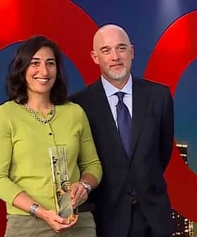 Three individuals at an award ceremony, one holding a trophy and smiling. - Olive Oil Times
