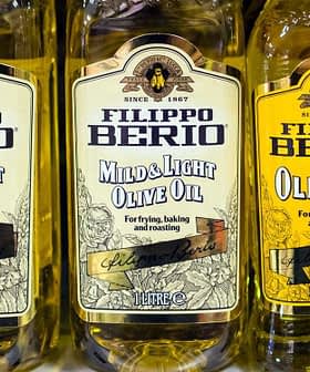 Five bottles of Filippo Berio olive oil in various types, including mild and light options. - Olive Oil Times