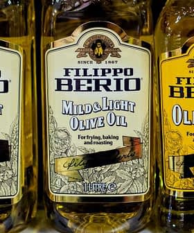 Three bottles of Filippo Berio olive oil labeled 'Mild & Light' and 'Olive Oil' on a shelf. - Olive Oil Times