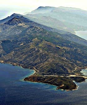 Aerial view of Ikaria Island showing mountainous terrain and coastal features. - Olive Oil Times