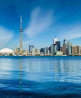 Panoramic view of Toronto skyline featuring the CN Tower and waterfront. - Olive Oil Times