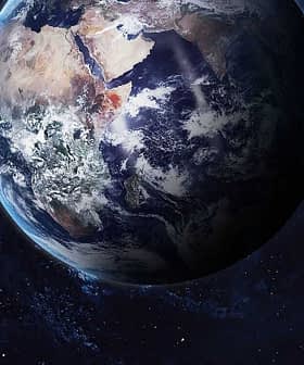 A detailed view of Earth from space, showing landmasses and oceans against a dark background. - Olive Oil Times