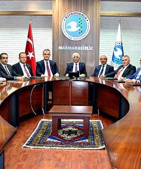 Group of individuals seated around a large conference table during a meeting at Marmarabirlik. - Olive Oil Times