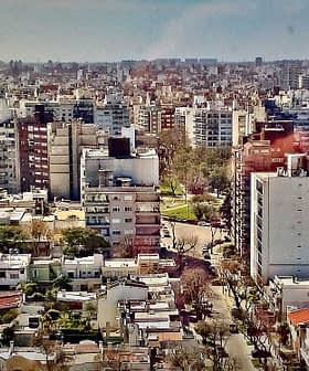 Aerial view of a densely populated urban area in Buenos Aires with various buildings and structures. - Olive Oil Times
