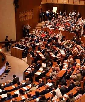 Interior view of a conference hall filled with attendees during an Italia Olivicola event. - Olive Oil Times