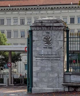 Entrance gate of the World Trade Organization headquarters in Geneva, Switzerland. - Olive Oil Times