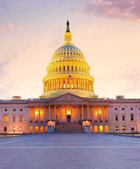 United States Capitol Building illuminated at sunset with a colorful sky in the background. - Olive Oil Times