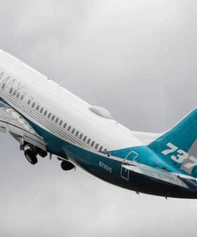 Boeing 737 aircraft taking off with a blue and white livery against a cloudy sky. - Olive Oil Times