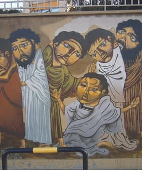 Mural featuring six figures in traditional attire with expressive faces and varied postures. - Olive Oil Times
