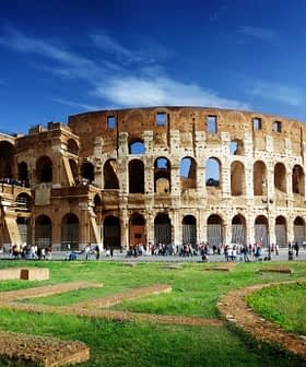 The Colosseum in Rome, an ancient amphitheater with arches and a partially intact structure. - Olive Oil Times